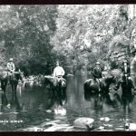 A photograph depicting four men on horseback in the Deua River. Left to right they are: Alan Rankin Snr; Percy Byrnes (?); Bill Rankin; and unknown.