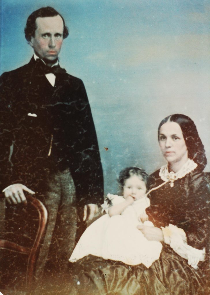 A copy of a hand tinted portrait of John Huxham Blatchford, his wife Thirza and their daughter, Helena.