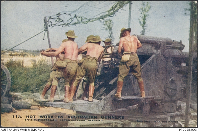 A picture titled 'Hot work by Australian gunners'. Gunners of the Australian Siege Artillery Brigade ramming home a shell in a 9.2 inch breech loading howitzer on a hot summer's day. The batteries of this brigade were among those that supported the1st Anzac Corps at Pozieres.